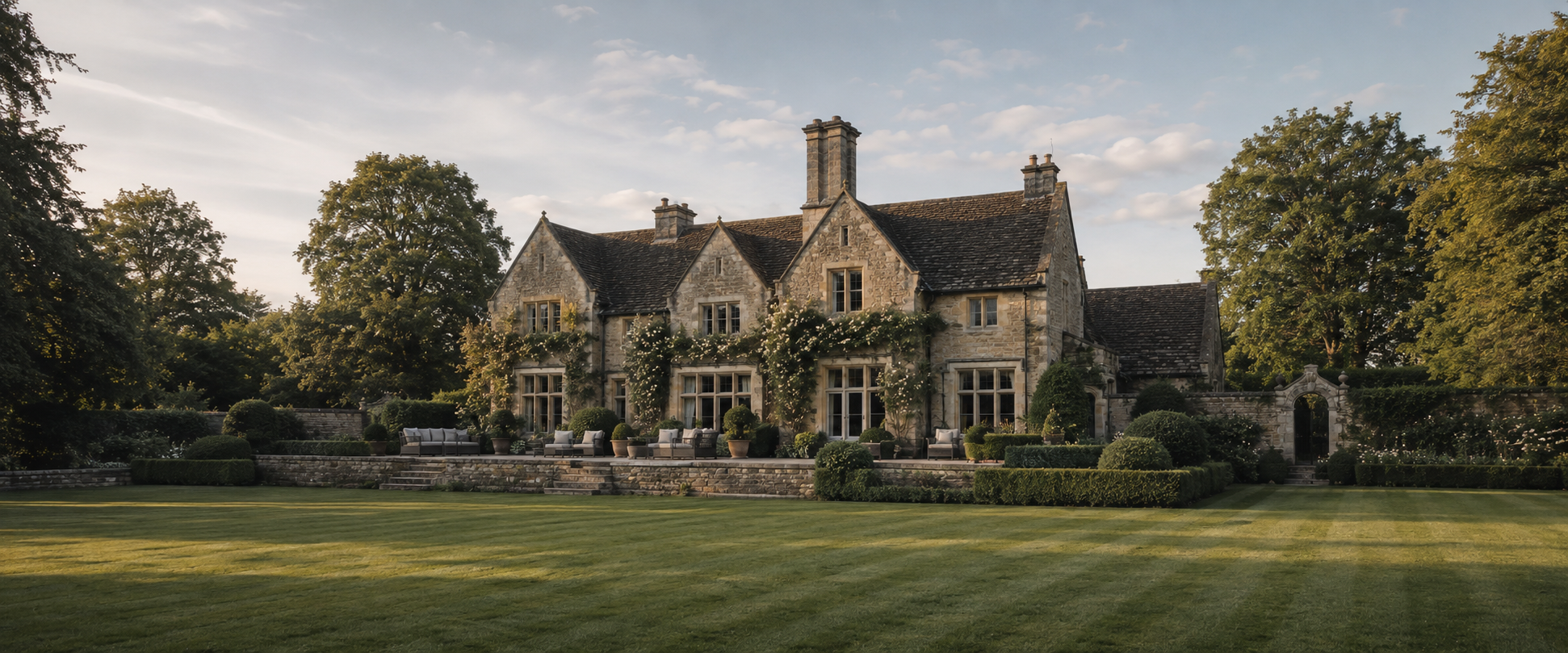 The back of the house and the south lawn at Ashcroft, late light